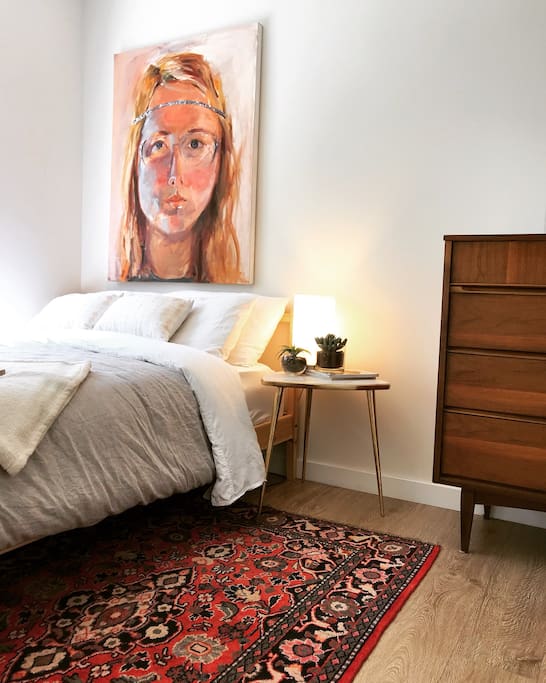 Private bedroom comes complete with a tempurpedic mattress topper and a gorgeous hand woven Parisian rug! The light in this room is magic!