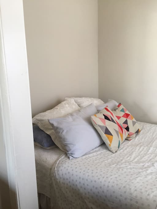 The bed is a queen sized bed.