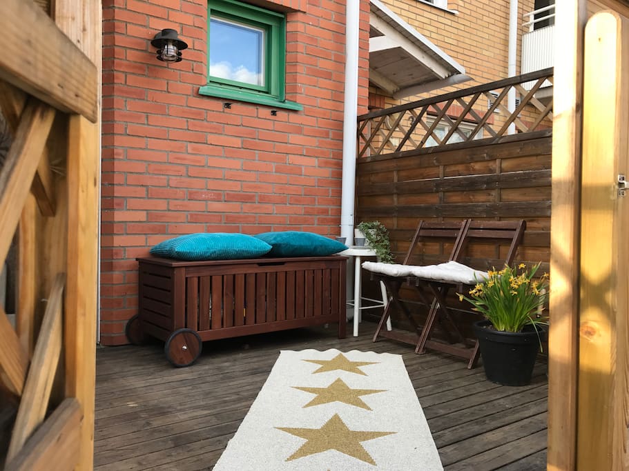 Porch, perfect when the kids are playing at the playground right outside. Sunny from early morning until about 14:00.