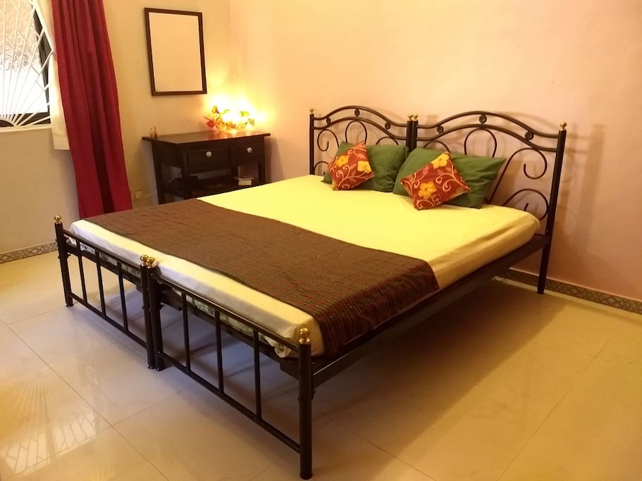 First bedroom (ground floor / ceiling and pedestal fan)