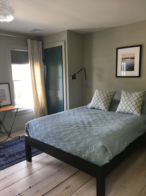 Comfortable queen bed with 100% cotton bedding in air-conditioned, private room