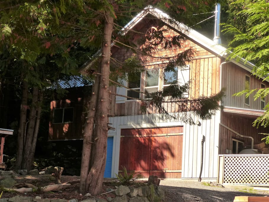 The Cottage is located on the left side of the driveway...up the stairs...it feels as you are staying in the treetops ...all the space upstairs is yours...the Cabin on the left (if you need extra space or some of your party wants more privacy)