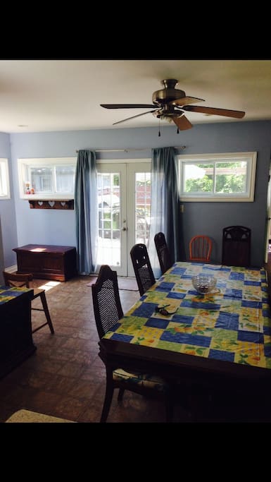 Open concept dining area leading to back deck