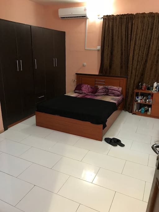 Private Room with Queen Size Bed, Fully Standard Wardrobes, Side Dresser, Work Station, Television with Satellite Access, AC, Private Bathroom and Toilet
