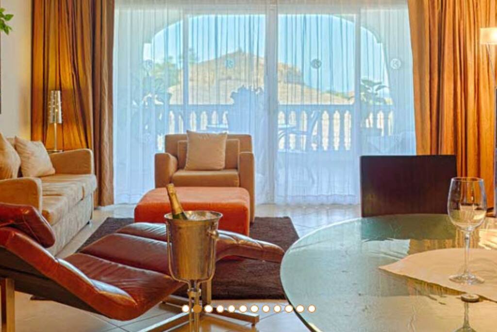 Spacious and contemporary living room leads to private balcony