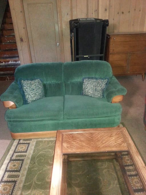 Another love seat, treadmill and dresser