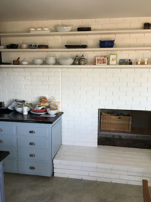 Fireplace connects kitchen and living room