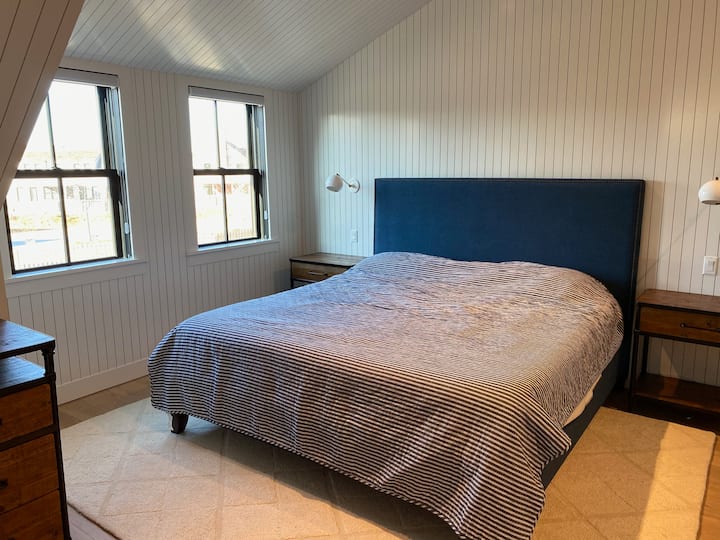 Master bedroom with desk, walk in closet and en suite bathroom