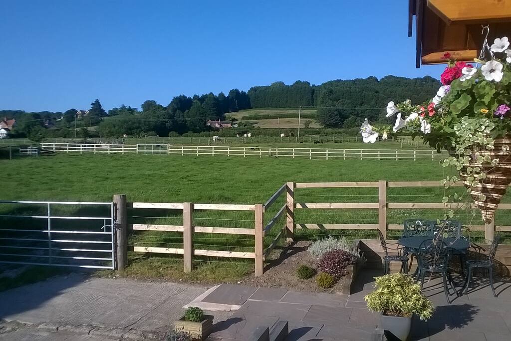 Looking over the fields from the front door. Seating on the lower patio for 5 - ideal stop for morning coffee