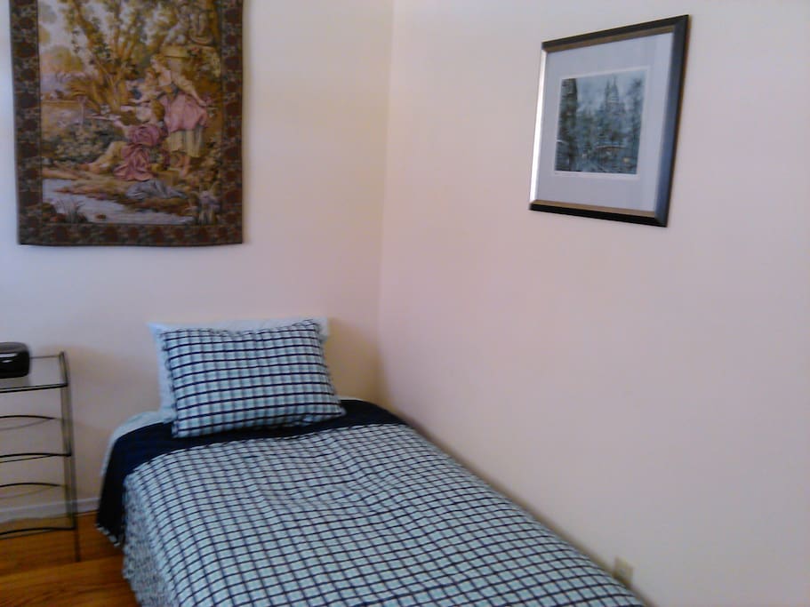 Comfortable twin size bed and nightstand.