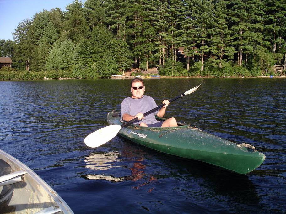 House is behind my left paddle behind the trees