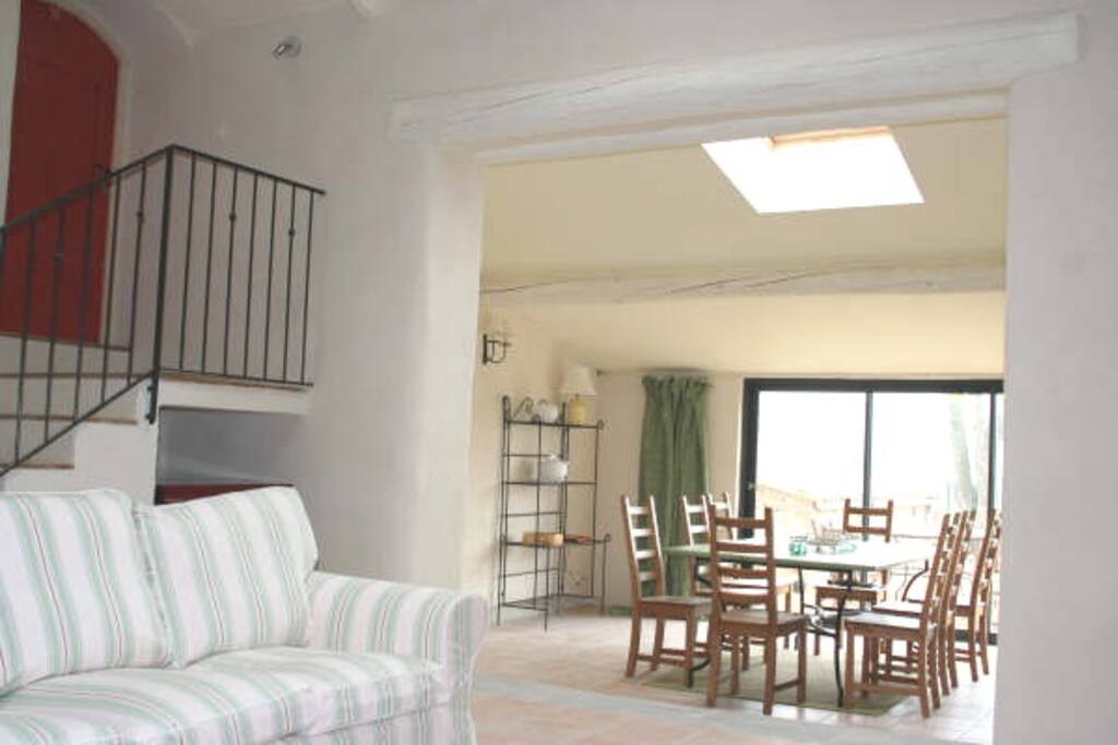 large salon leading to dining room and pool area. Steps to another salon, 2 bedrooms and upper terrace.
