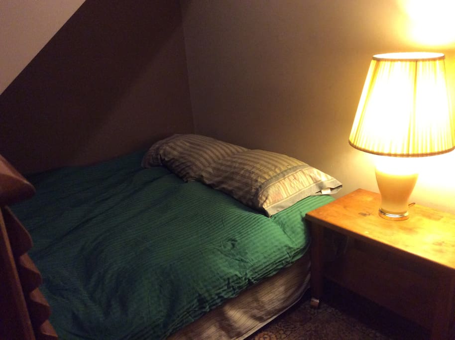 The little bedroom with queen bed.