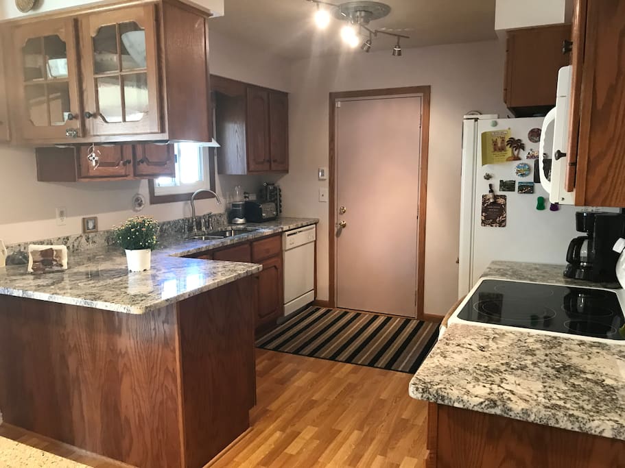Kitchen with newer appliances and granite countertops