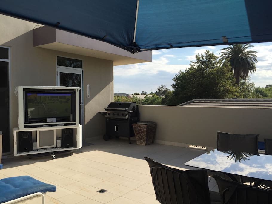 Pictured is the Prestige Apartments Main Balcony which has direct access from the guests King bedroom and also the kitchen. Entertain family,friends or yourself, cook up a feast on the gas bbq and enjoy at the outdoor alfresco dining setting, catch some rays on one of the comfortable resort day beds or outdoor beanbag or better still, wheel the outdoor TV, DVD & Stereo Entertainment Unit into position, grab some beverages, pop on a movie or watch the big game from the outdoor spa.
