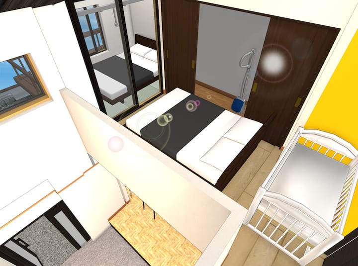A view of the center room (hallway) and tatami room - double size mattress will be directly on the floor (without bed frame).  A baby cot (Pack'n Play) can be placed as requested.