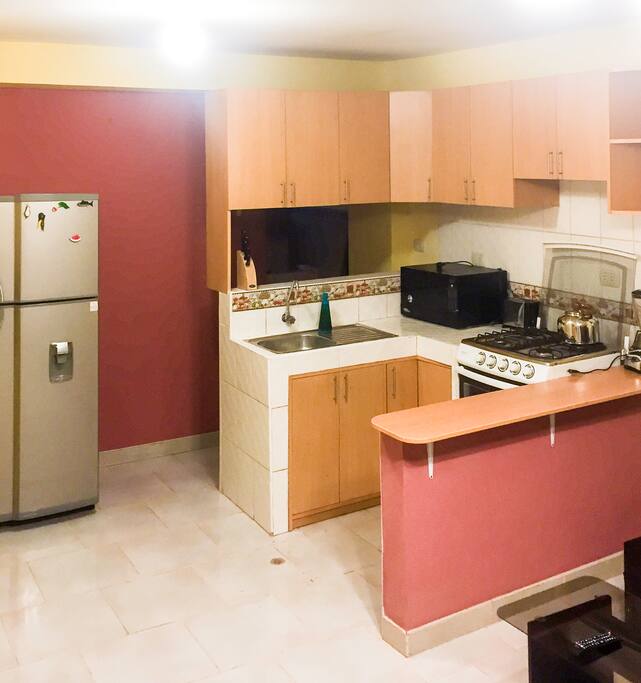 The kitchen is fully equipped with the freezer, microwave oven, toaster , four burner stove. We also have a full kitchen utensils.