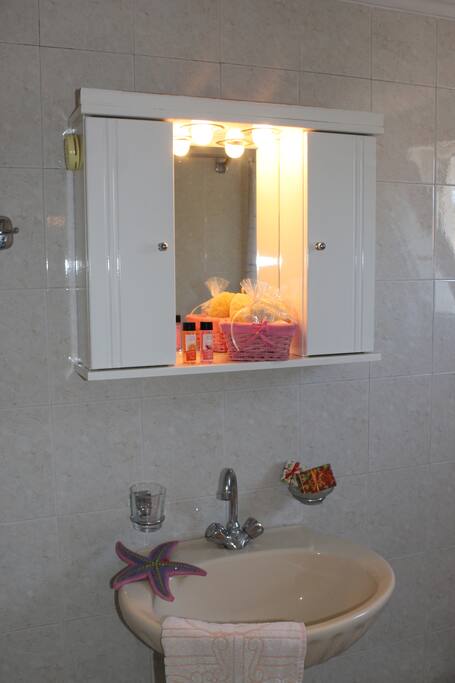 Τwo small identical bathrooms with shower.