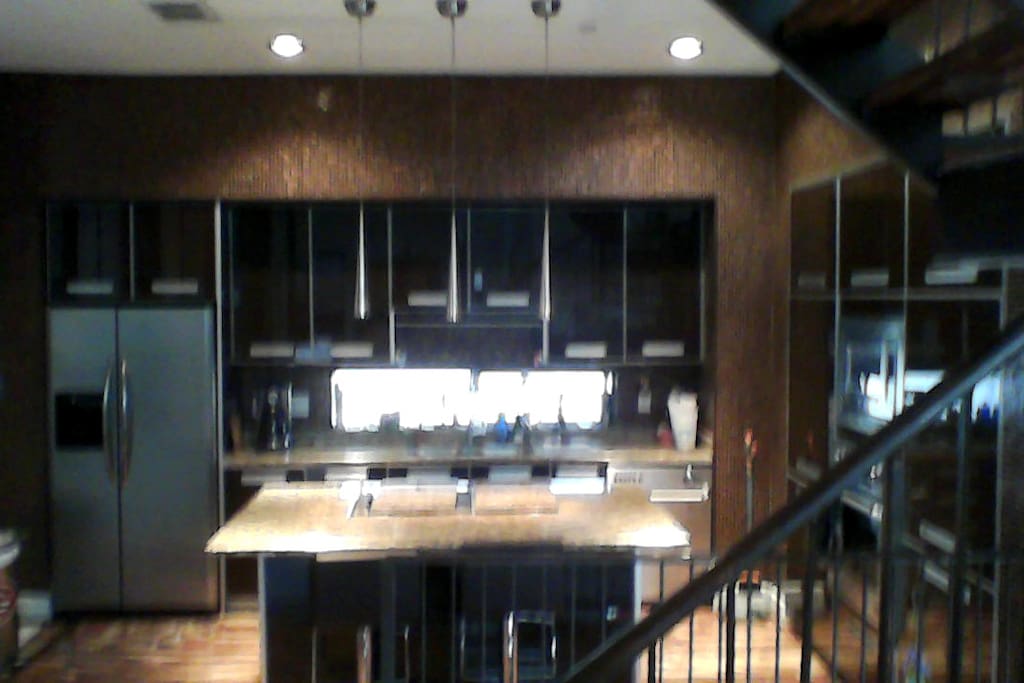 Modern kitchen with full size refrigerator.