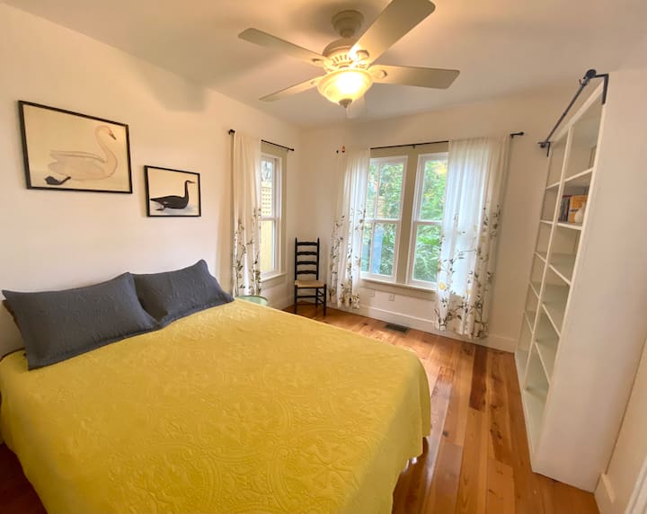 Queen bedroom on the main floor just off the kitchen with views of the backyard