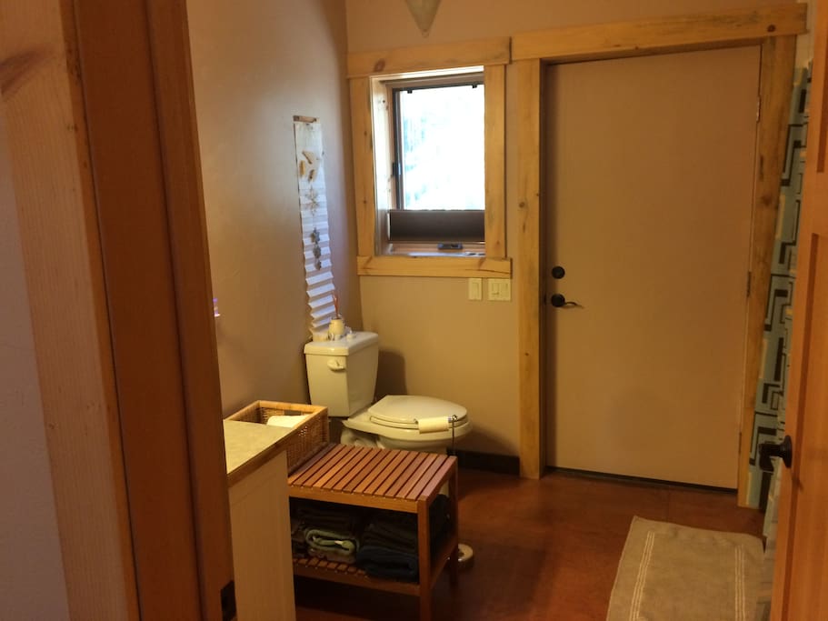 bathroom, with entrance onto the side deck