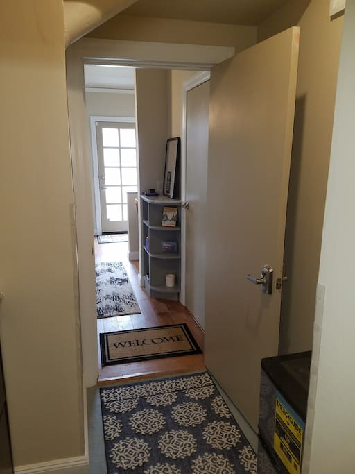 Entryway shoe box and mini fridge with complimentary beverages