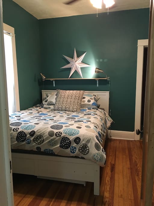 The bedroom is modern and comfortable, the bed is a Queen.