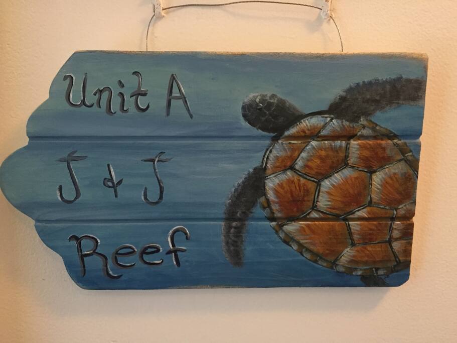 Plack at the front door. Painted by my talented sister.