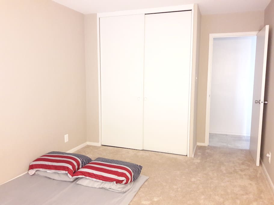Bedroom with full cupboard