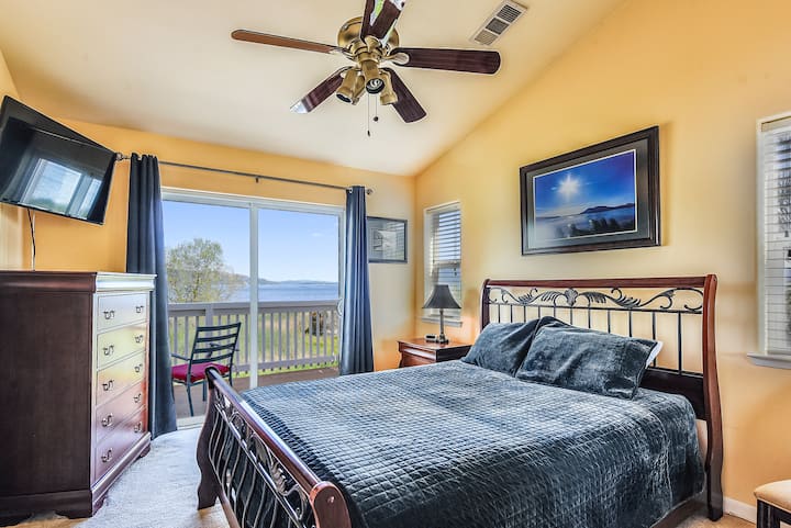 Upstairs queen bedroom with balcony and private or shared bathroom.