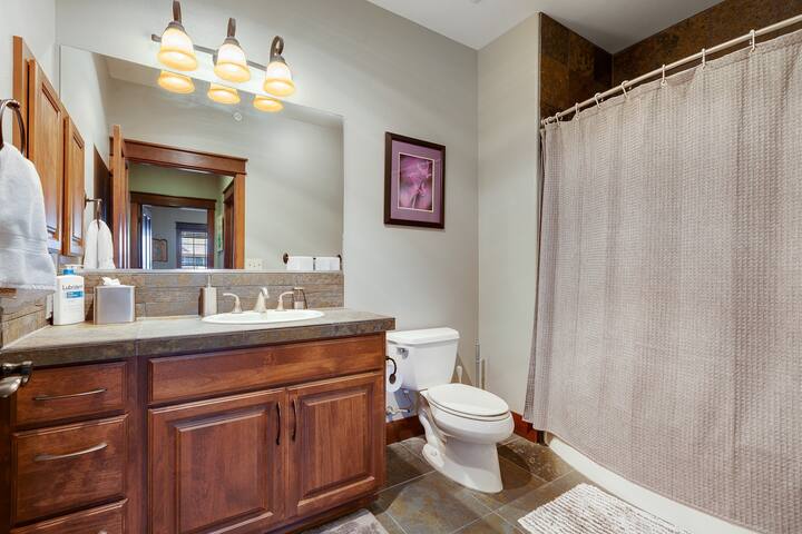 Second bathroom offers large garden bathtub and shower.