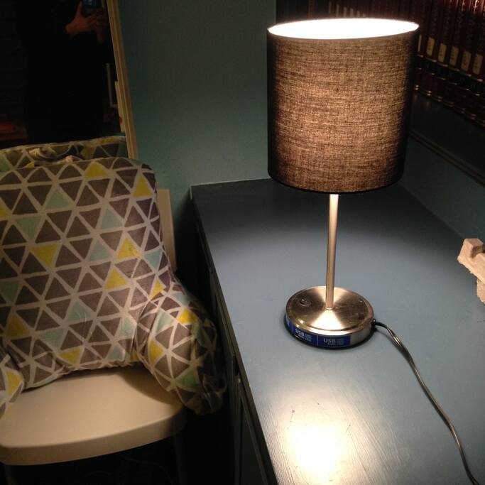 Desk and chair work area with books, electric outlet, Wifi