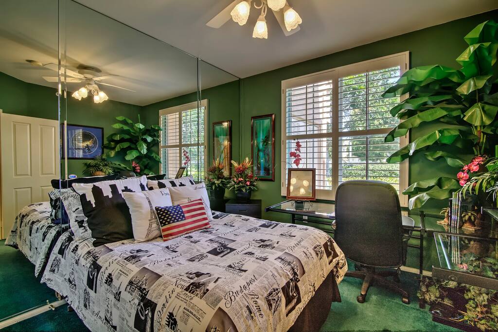 Check in with the real world at the guest bedroom desk.