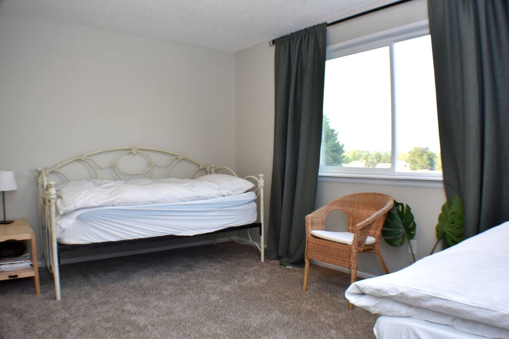 The bedroom can be configured into a queen or two twin beds.