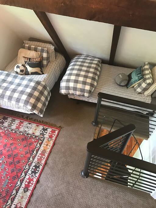 Spacious family room upstairs. 4 twin size beds.