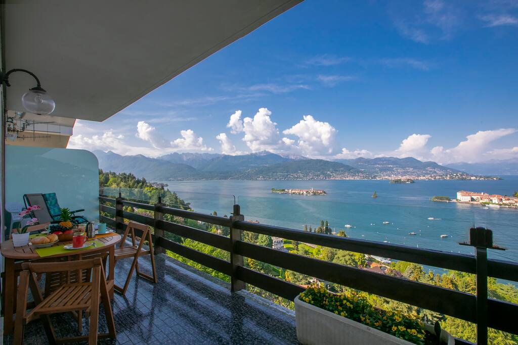 Terrace with a dining set for 4 and a view of the lake