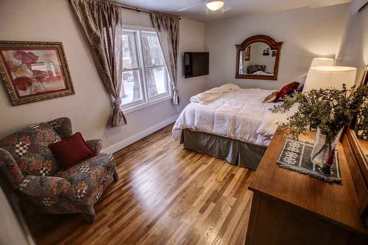 King Bedroom on 1st Floor. Decorator touches will make you right at home on your first and repeat visits.