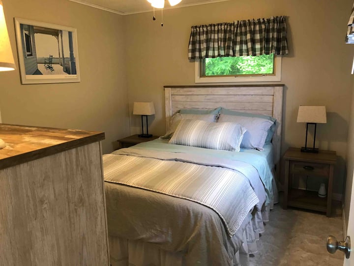 Second bedroom has a Queen bed, dresser and good-sized closet. Two windows let in both light and fresh air. There is also a ceiling fan. The air conditioning unit is right outside this room, in the living room, at the north end of the home.