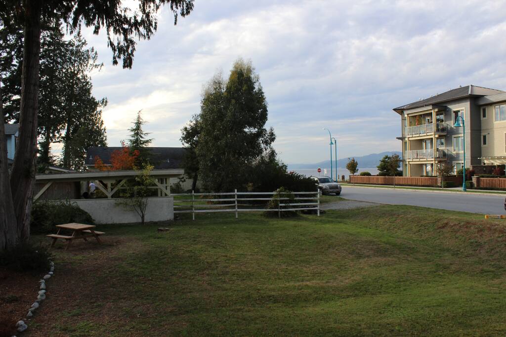 View of backyard and ocean view from deck