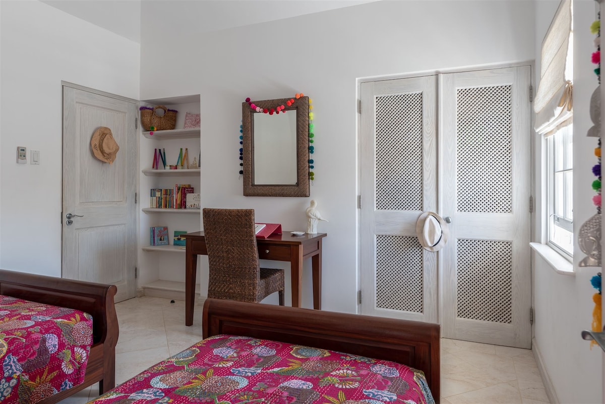 Our girl's room, the 3rd bedroom with twin beds, in built wardrobe and desk/dressing table.