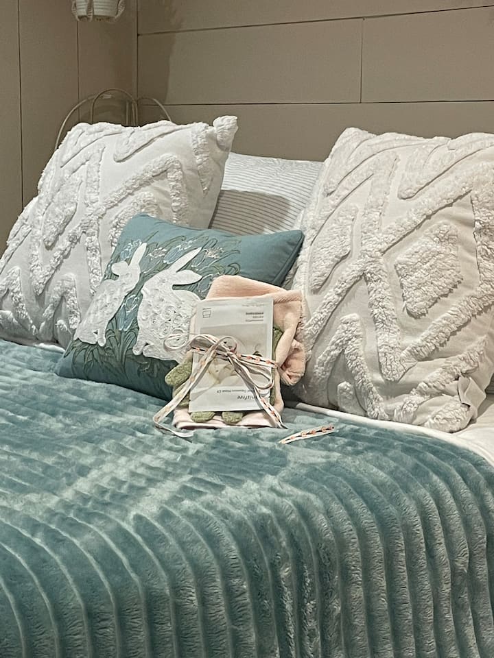 Bed is dressed for the season we’re in . 