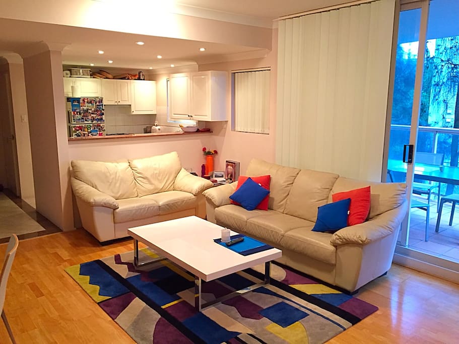 Apartment has outdoor balcony with outdoor dining area and barbecue