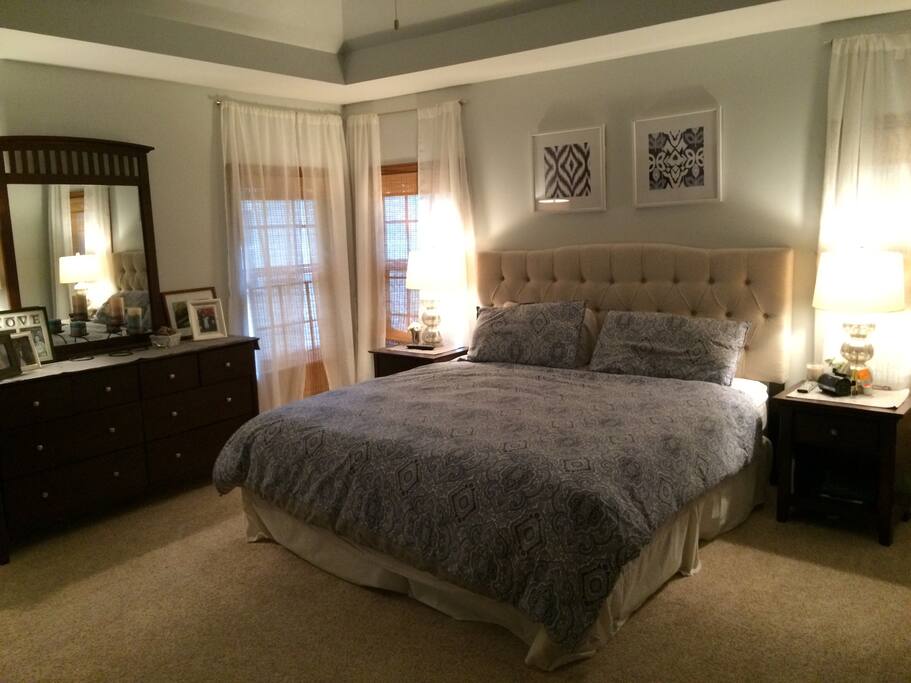 Master bedroom with king bed and attached bath