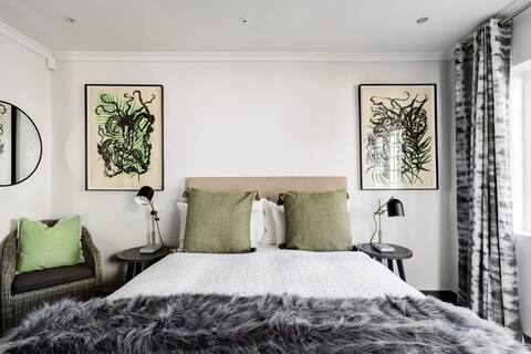 Take it Easy on the Covered Porch at a Refined Urban Haven