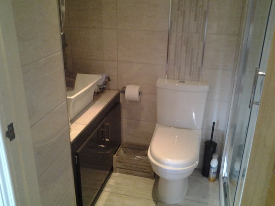 En suite bathroom complete with power shower