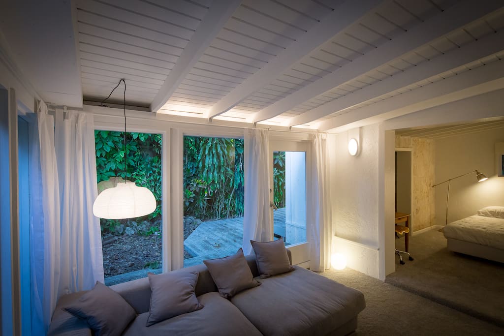Suite living area view. This living area is ultra relaxing and peaceful. The floor to ceiling windows allow you to enjoy the beauty of the natural trees outside while you are comfortably enjoying time with your friends and loved ones :-)