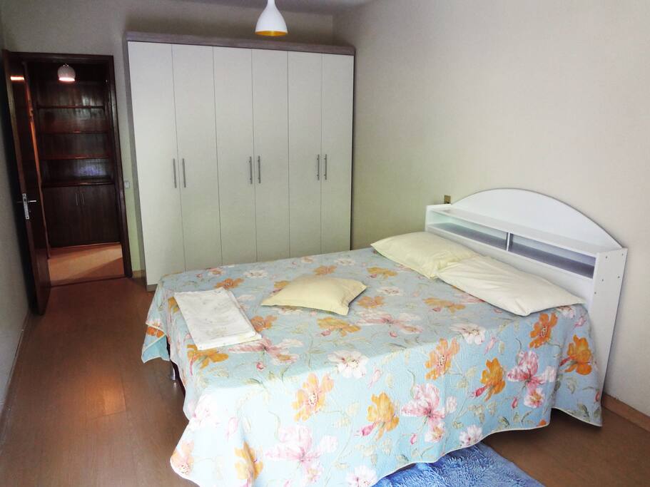 A cozy bedroom with an air conditioning