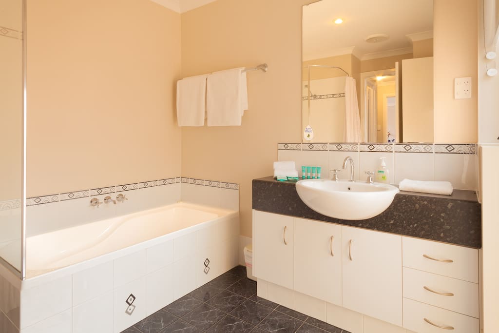 Bathroom with shower, bath and separate toilet