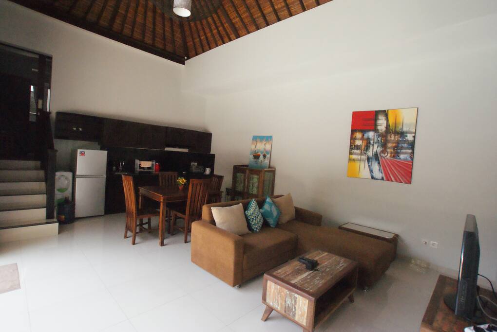 View looking into the living area from pool. The living space features a folding door which can be opened fully.