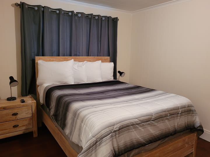 Bedroom #2 - Sand Room. Queen bed with 32-inch smart TV
